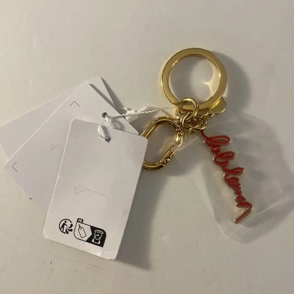 Lululemon keychain/ bag charm, red and gold tone - Picture 2 of 3
